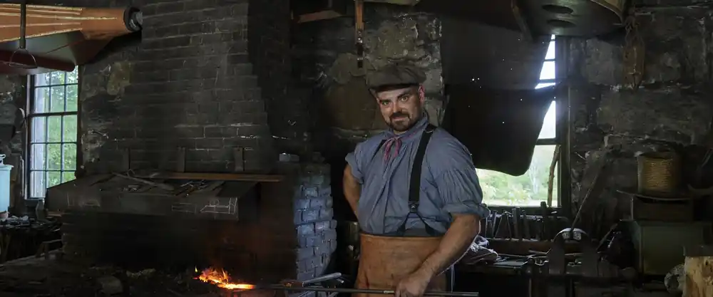Blacksmith at the anvil at Old Sturbridge Village, Massachusetts