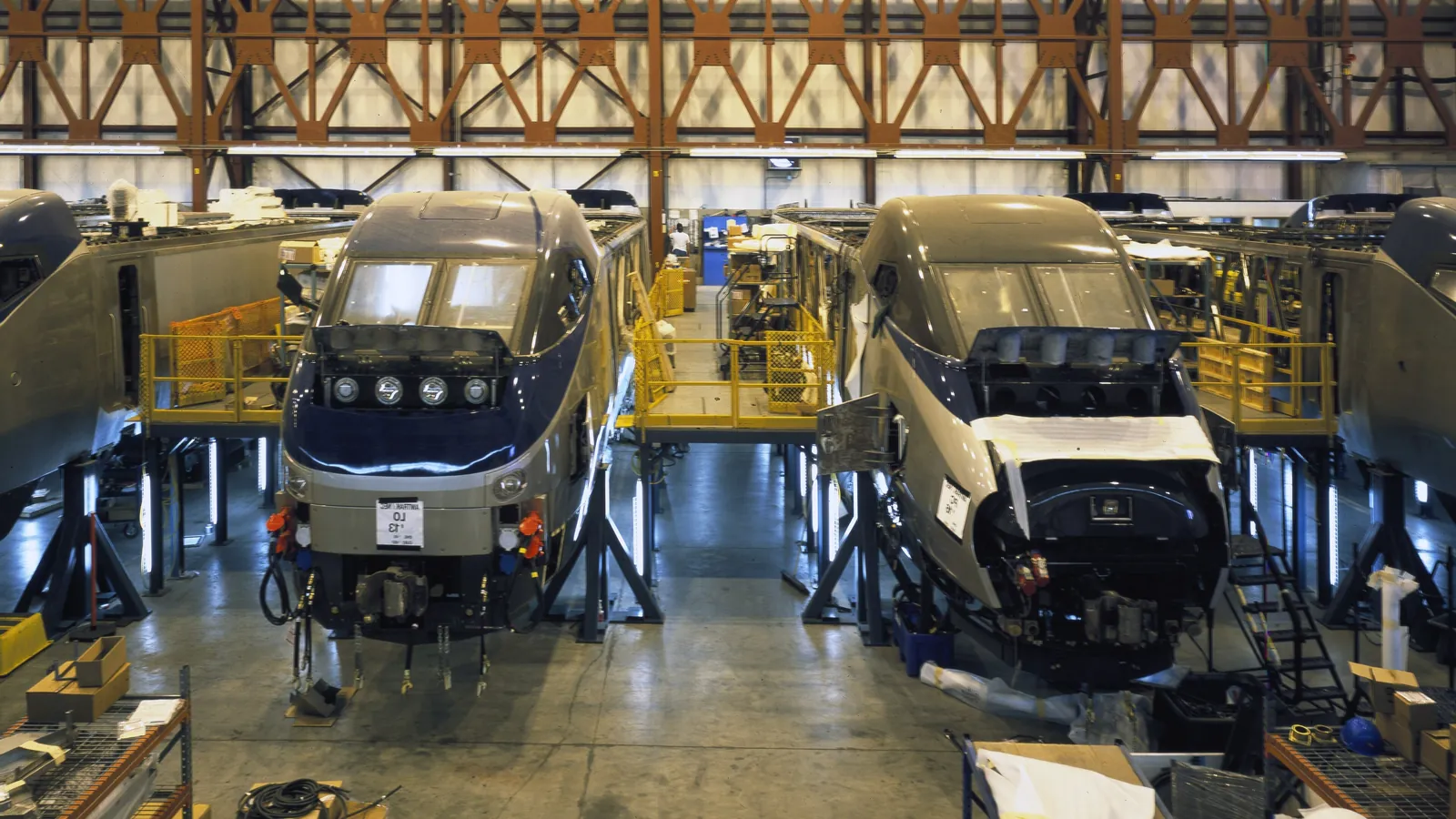 Partly built high-speed passenger rail cars on the factory floor of a plant in Barre, Vermont